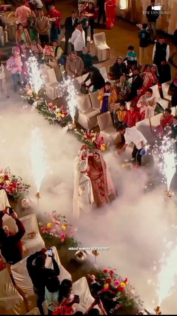 "Bride and groom entry with a dramatic fog effect at their wedding celebration"