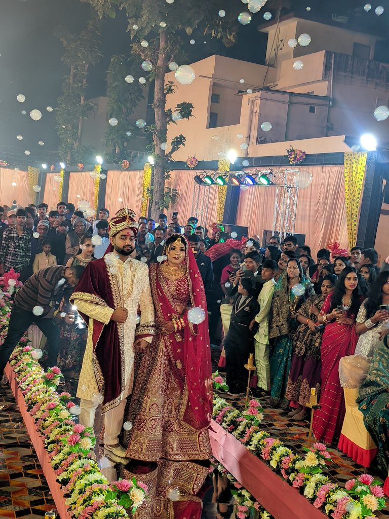 "Stylish bride entry through a mirror entry with sparkling reflections and glamorous lights"