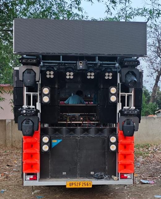 Barat & DJ on Wheel in Siwan with vibrant lights, LED screen, and full dance floor setup for wedding celebration.